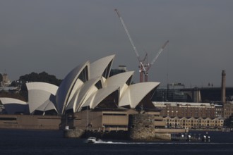 View of Sydney Opera House with a crane in the background, Sydney, NSW, Australia