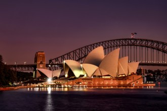 Sydney Opera House and Harbour Bridge at dusk with lights, Sydney, New South Wales, Australia