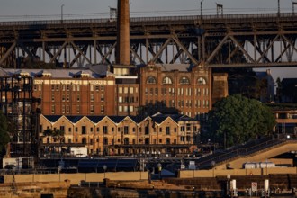 Historic facades and bridge in warm sunlight, Sydney, NSW, Australia