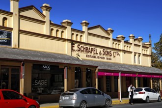 Historic building on Tanunda's main street with signs and shop windows, Tanunda, South Australia,