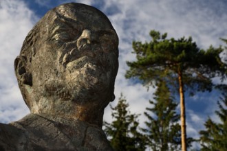 Large bust of Lenin in Grutas Park in Druskininkai under a blue sky, Druskininkai, Lithuania