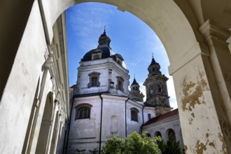 Baroque Pažaislis monastery with towers and arches under blue sky, Kaunas, Kauno apskritis,