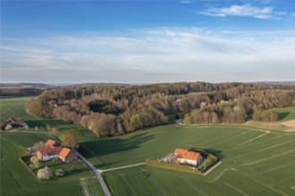 Small farms surrounded by green fields and forests from a bird's eye view, Osnabrücker Land, Wiehen