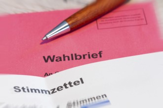 Absentee voting symbol: Close-up of a ballot letter with a ballot paper attached