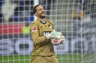 Goalkeeper Oliver Baumann TSG 1899 Hoffenheim (01) with ball smiling PreZero Arena, Sinsheim,