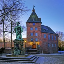 Moers Castle with the monument to Electress Louise Henriette of Brandenburg early in winter, Moers,