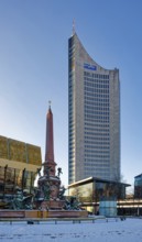 Mendebrunnen, Gewandhaus and City Tower on Augustusplatz in winter with snow, Leipzig, Saxony,