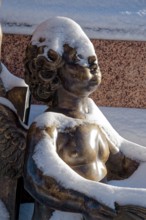 A snowy angel, figure at the Felix Mendessohn Bartholdy monument in winter with snow, Leipzig,