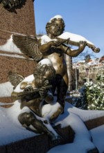 Two angels playing music, figure at the Felix Mendessohn Bartholdy monument in winter with snow,