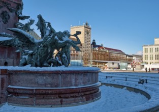 Mendebrunnen, Kroch skyscraper on Augustusplatz in winter with snow, Leipzig, Saxony, Germany