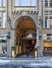 Grimmaische Straße entrance, historic Mädlerpassage shopping arcade in winter with snow, Leipzig,