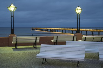 Kurplatz am spa hotel, in the back the pier and Baltic Sea, illuminated, Blaue Stunde, Binz,