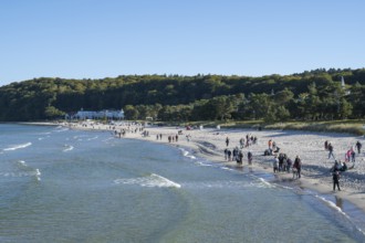 Tourists on the beach in autumn, Baltic Sea, Binz, seaside resort, Rügen island,