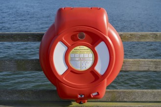 Lifebuoy at the pier, Baltic Sea in the background, Binz, seaside resort, Rügen island,