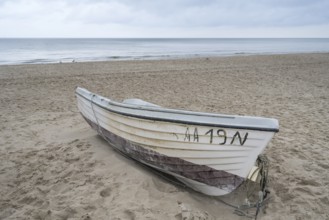 Boat is located on a sandy beach, Baltic resort Göhren, Baltic Sea, Rügen Island,