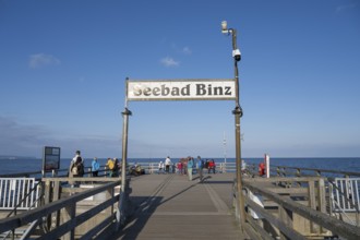 Tourists on the pier, sign Seebad Binz, Binz, seaside resort, Rügen island, Baltic Sea,