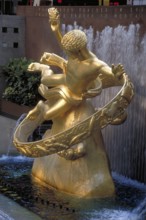 Gold-colored Prometheus statue in Rockefeller Center, New York City, USA