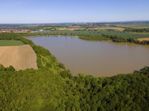 A quiet lake surrounded by forests and fields under clear skies, aerial view, Groß Bülten-Adenstedt