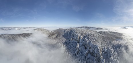 Aerial view of snowy stone walls and fog in the valley, Schwarzensee, Weissenbach an der Triesting,