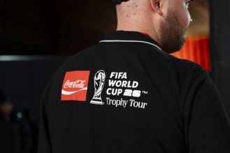 An official wearing the FIFA World Cup 2026 Trophy tour t-shirt during the official India tour in
