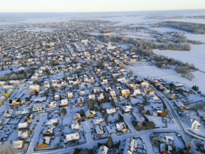 Winter aerial view of a village with snowy houses and landscapes in the background, Aerial view,