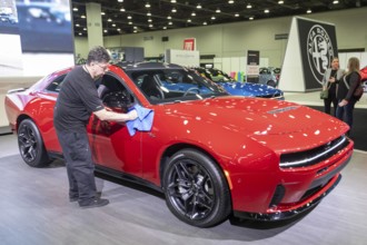 Detroit, Michigan USA - 14 January 2026 - A worker polishes the Dodge Charger Sixpack at the
