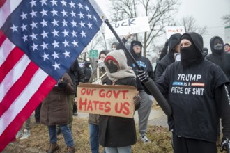 Detroit, Michigan USA - 13 January 2026 - Hundreds of protesters rallied in the rain outside the