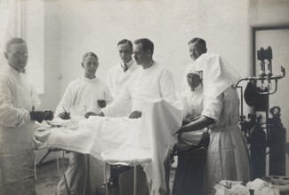 Einar Key (fourth from left), a Swedish surgeon, in an operating theatre with other members of the