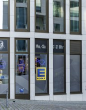 Yellow-blue Edeka company logo on a new building on Invalidenstraße in Mitte, Berlin, Germany