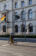Cyclists on Invalidenstraße in front of the Federal Ministry of Economics and Energy building,