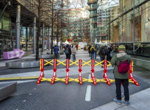 Massive metal access barriers in red and yellow at Center Potsdamer Platz, Berlin, Germany