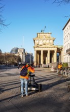 Measurement of the walkway at the Brandenburg Gate near the American Embassy, Berlin, Germany