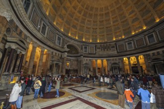 Tourist flow of visitors in Pantheon interior of ancient Roman temple with dome, coffered ceiling,