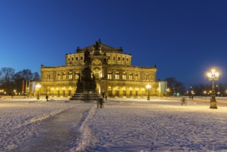 Illuminated Semper Opera House and Theatre Square with snow at dusk, Old Town of Dresden, Saxony,