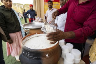 Vendor selling curd and cream dairy product at a stall in Bhogali Mela, ahead of the 'Magh Bihu'
