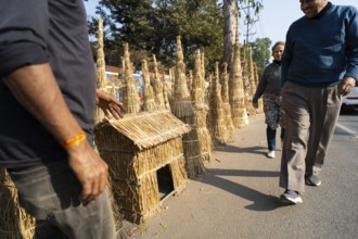 Vendor selling Meji (Bonfite), as part of preparations ahead of the 'Magh Bihu' festival, in