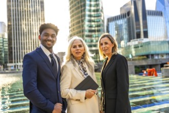 Diverse business team of professionals standing united and smiling, showcasing collaboration and