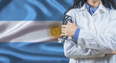 Healthcare professional with Argentina flag background. Professional doctor holding stethoscope on