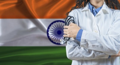 Healthcare professional with India flag background. Professional doctor holding stethoscope on