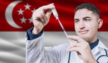 Doctor holding syringe on Singapore flag background. Medical professional holding syringe with