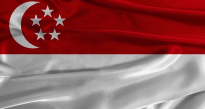 Flag of Singapore with fabric textured background. Close up of National flag of Singapore with