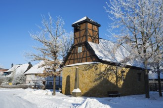 Snowy frame house in a village surrounded by snow-covered trees and clear sky, Old Chapel, 15th