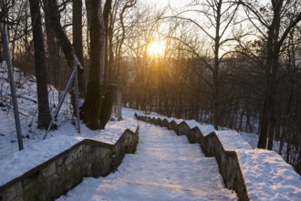 Snow-covered staircase with evening sun in Volkspark Friedrichshain on 07.01.2026