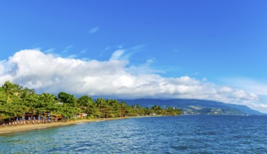 The urban coastline of Ilhabela meets the sea, forest, and mountains of São Paulo's coast,
