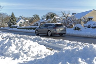 Snowy road, car, houses, winter, snow, Sieversen, Samtgemeinde Rosengarten, Lower Saxony, Germany