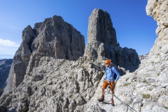 Climbers on the Via Ferrata Bocciere Centrale via ferrata, spectacular mountain landscape with