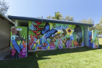 August 19, 2020. Artistically painted public toilet block featuring nature murals in a tropical