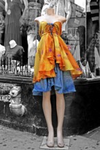 Headless mannequin dressed in colorful cloths in front of a fashion shop, black and white, New York