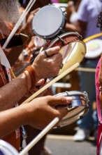 Tambourines and musicians during a carnival celebration in the streets of Brazil, Belo Horizonte,