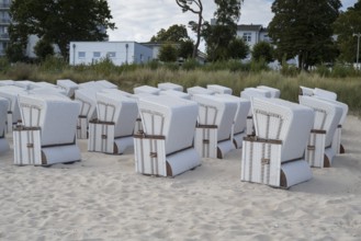 Beach chairs set up for transport to winter quarters, sandy beach, Baltic Sea, Binz, seaside